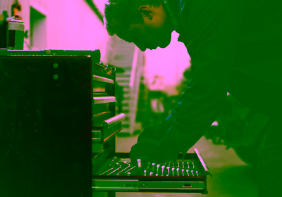 side-portrait-car-mechanic-taking-wrench-from-box-repair-shop-garage-warranty-repair-car-maintenance-concept